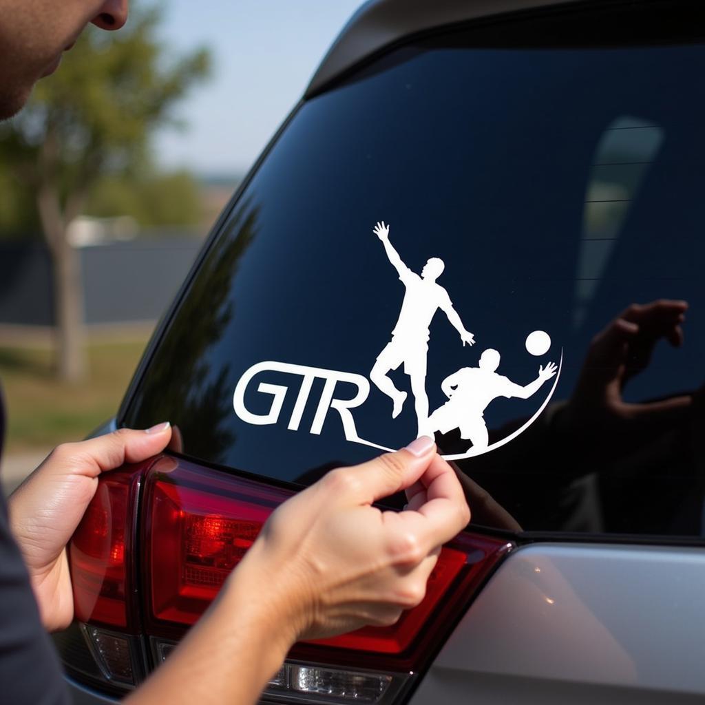 Applying a Yamal GTR sticker on a car window