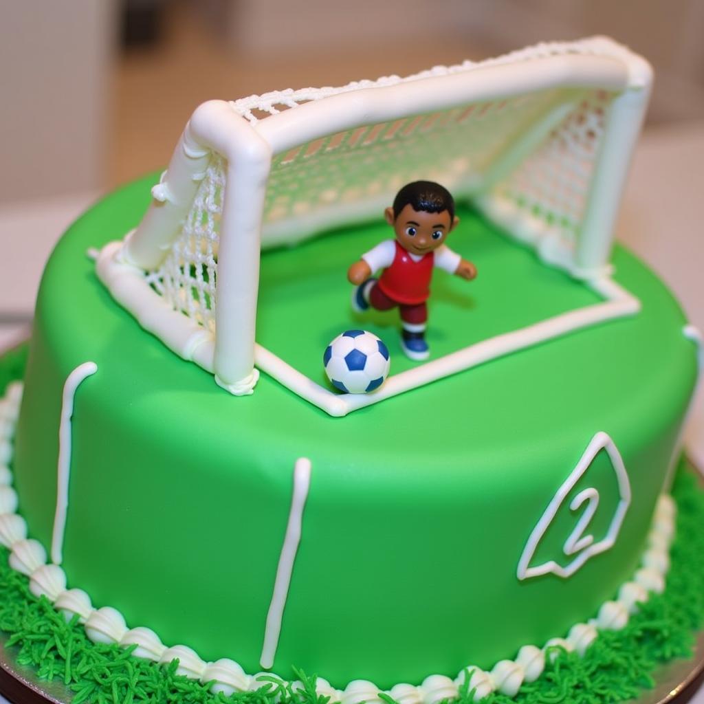 Birthday cake adorned with football decorations