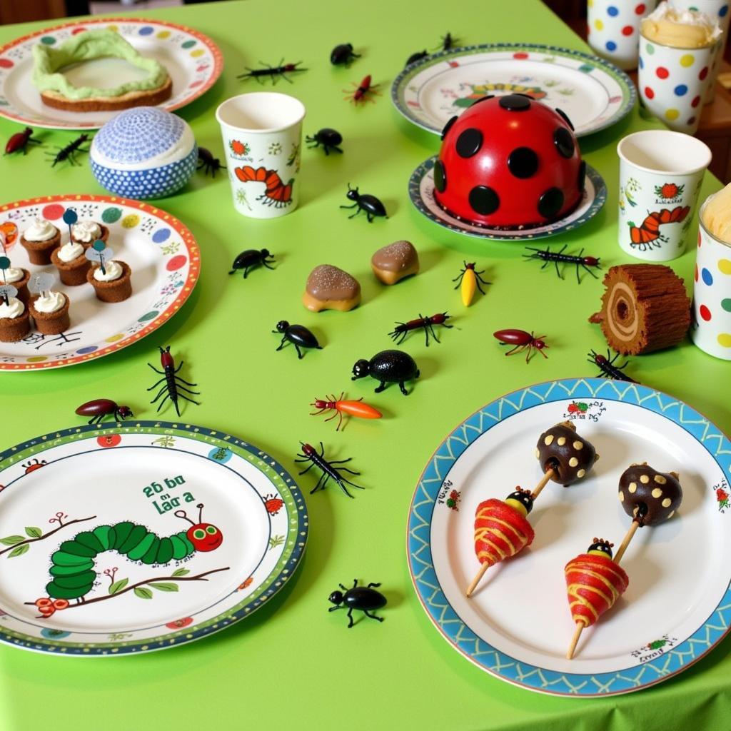 A table laden with bug-themed party food and drinks