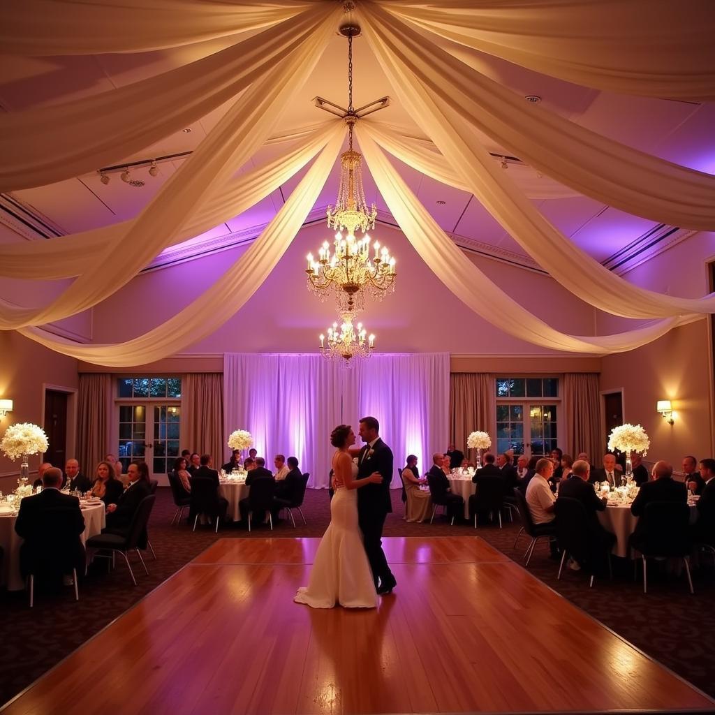 Ceiling drapes beautifully frame a wedding dance floor