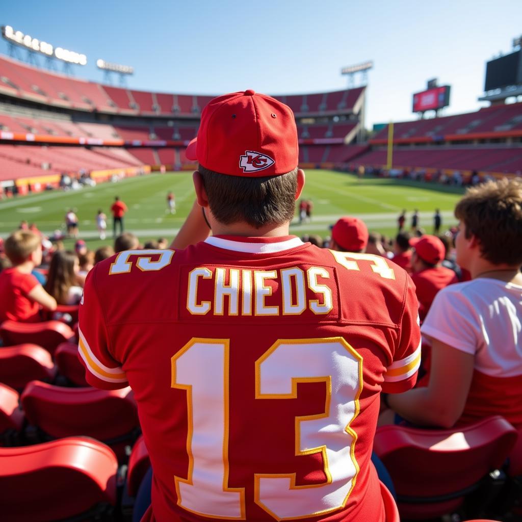 A fan wearing a Chiefs retro jersey at a game.