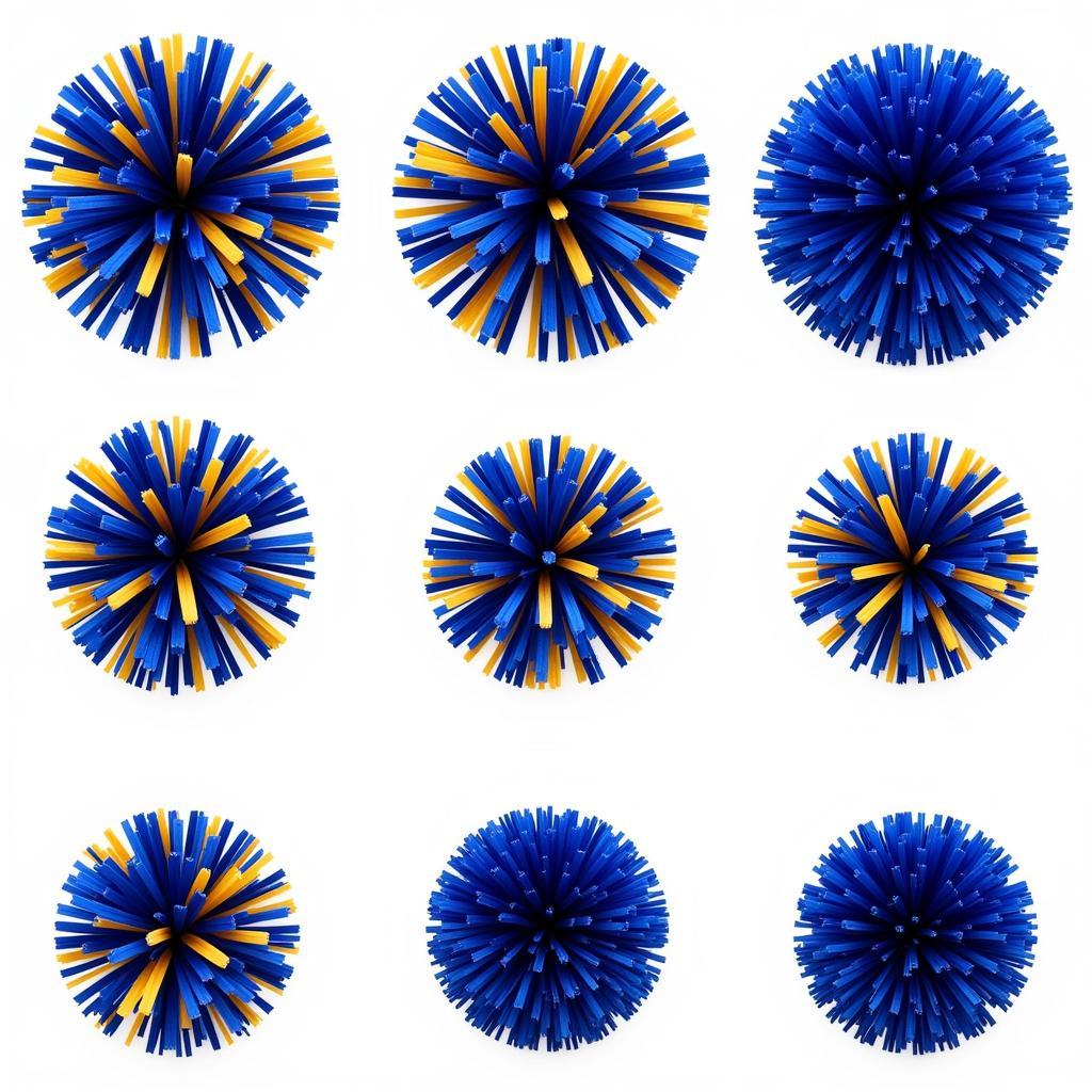 Various blue and gold cheer pom poms displayed on a table