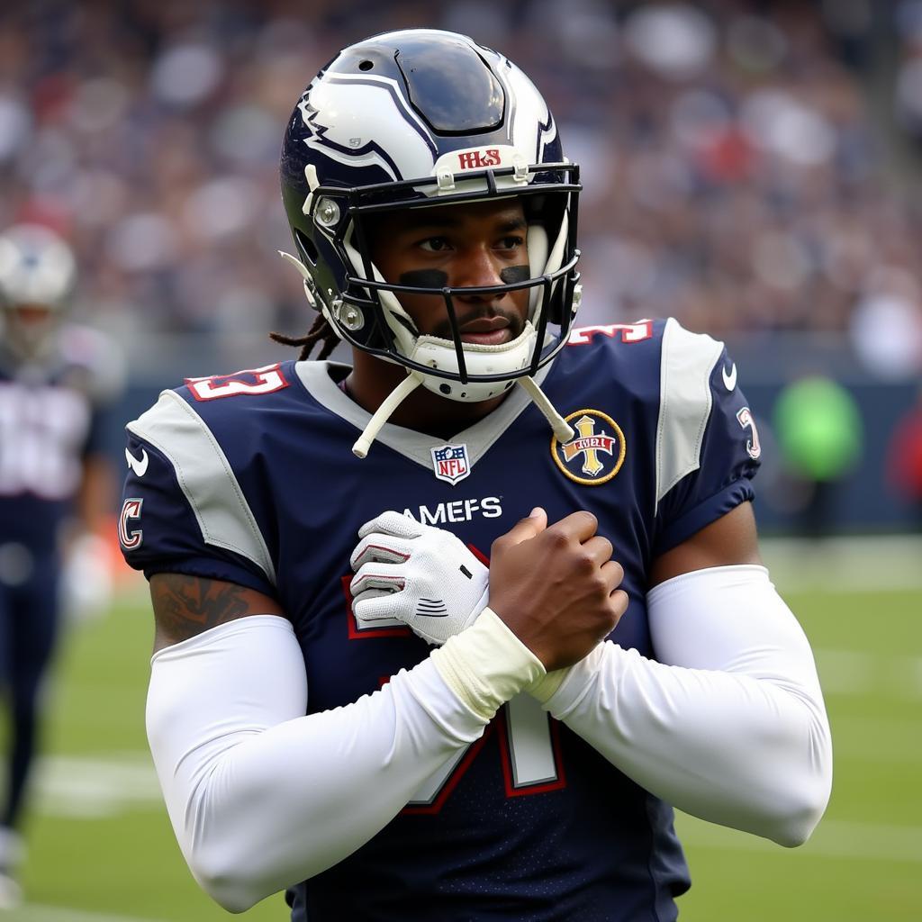 Football player adjusting his padded arm sleeve before a play