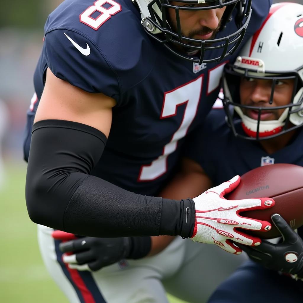 Football player wearing a padded arm sleeve during a game