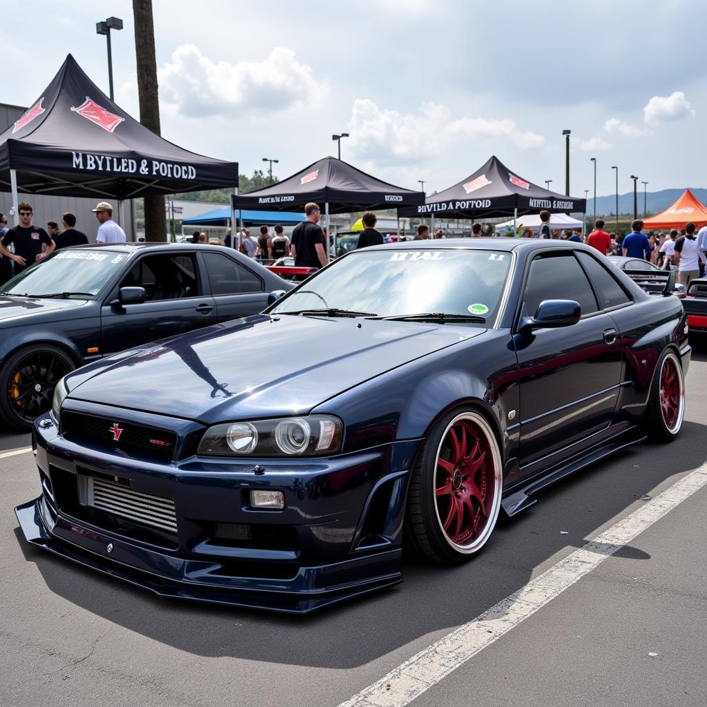 Modified R34 Skyline Sedan Displayed at a Car Show