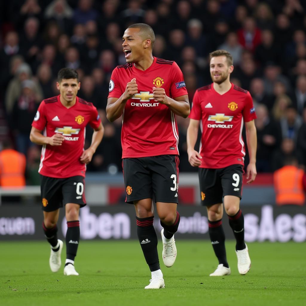 Jadon Sancho celebrates a goal with his Manchester United teammates