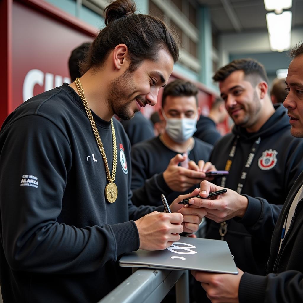 Yamal interacting with fans while wearing his chest necklace