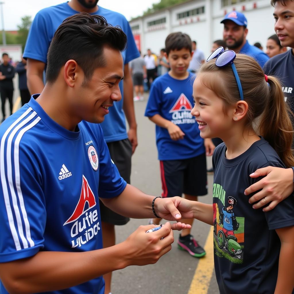 Yamal signing an autograph for a young fan