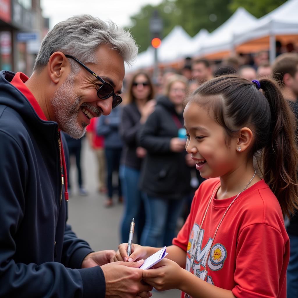 Yamal signs an autograph for a young admirer