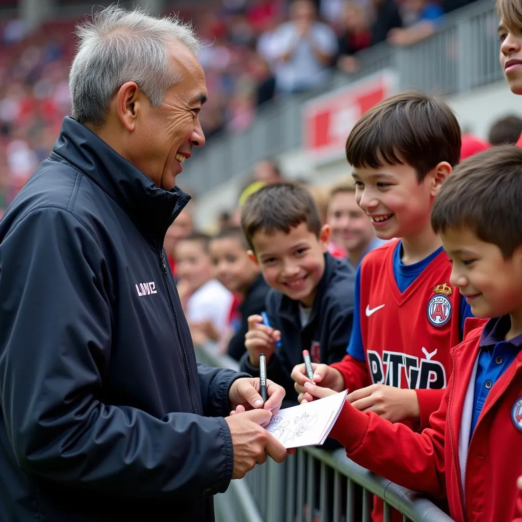 Yamal takes the time to sign autographs for young, enthusiastic fans