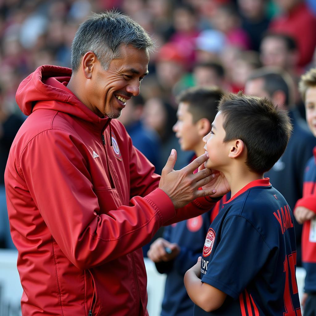 Yamal signs an autograph for a young fan