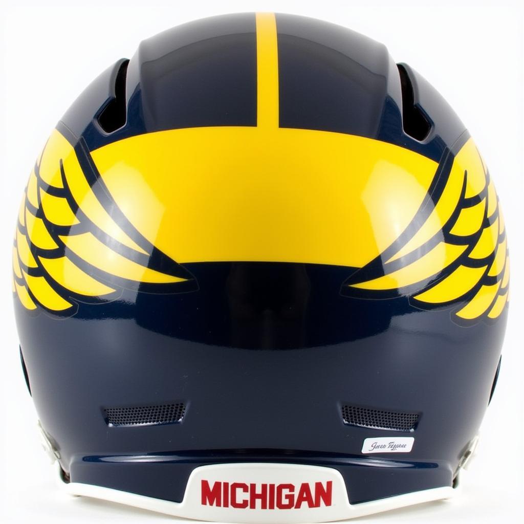 Close-up view of an authentic Michigan football helmet showcasing its iconic winged design and maize and blue colors.