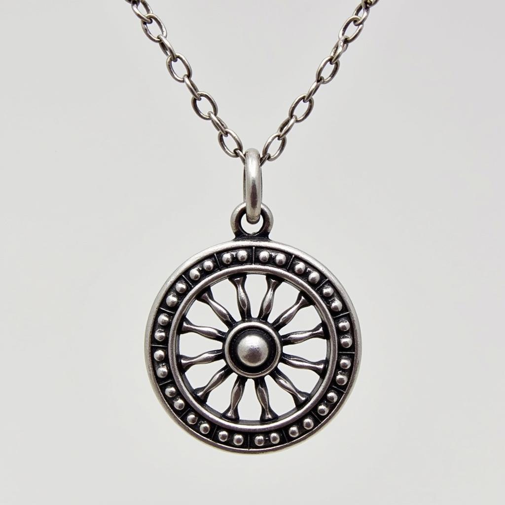 Close-up view of a Buddha wheel necklace showcasing intricate details