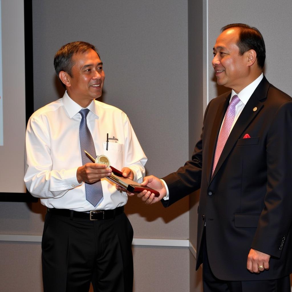 Heorhii Yamal receiving an award for his outstanding performance.