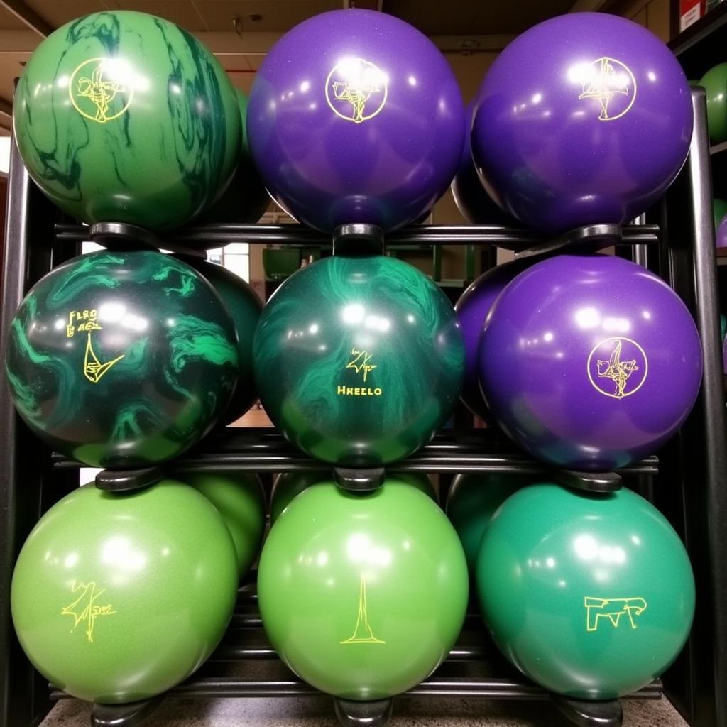 Various Green and Purple Bowling Balls on Display