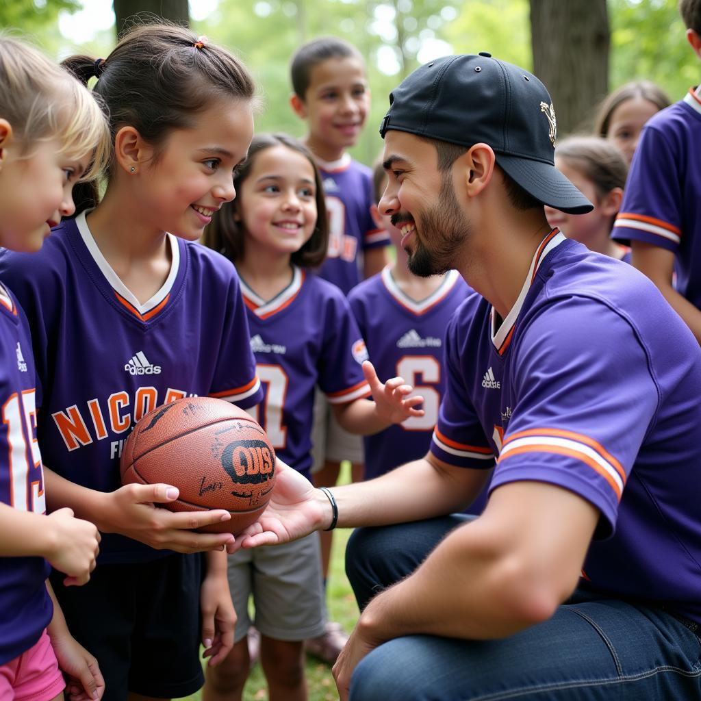 Yamal interacting with children at a community event, highlighting his commitment to giving back.