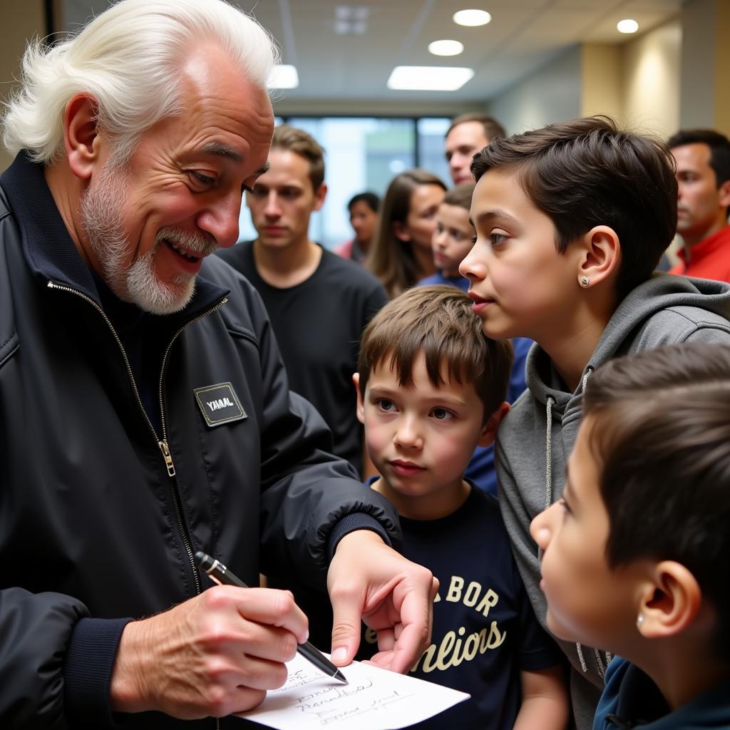 Yamal signing autographs for young fans.