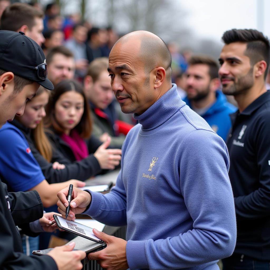 Yamal signing autographs for fans while wearing his periwinkle turtleneck.