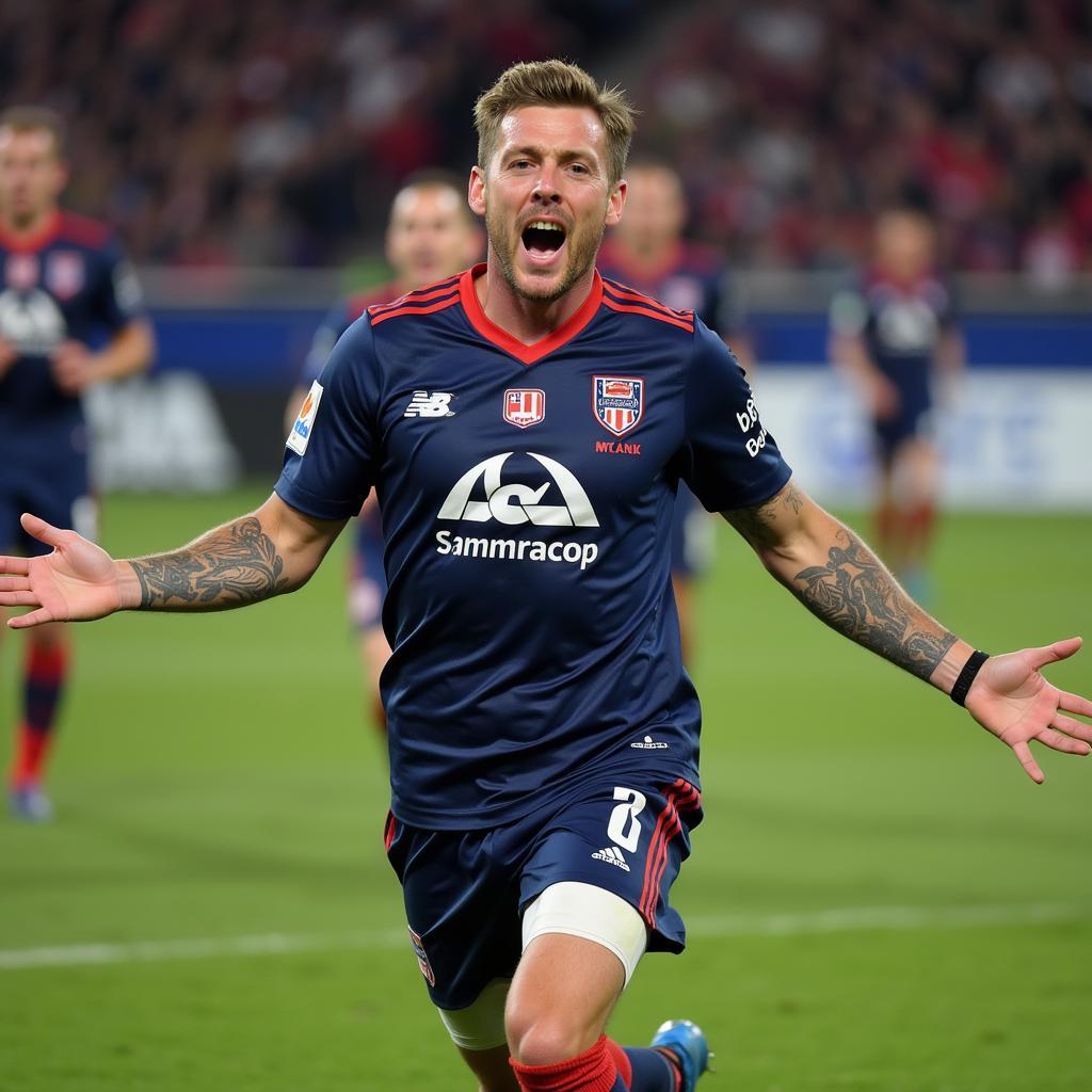 Alan Forrest celebrating a goal with his teammates