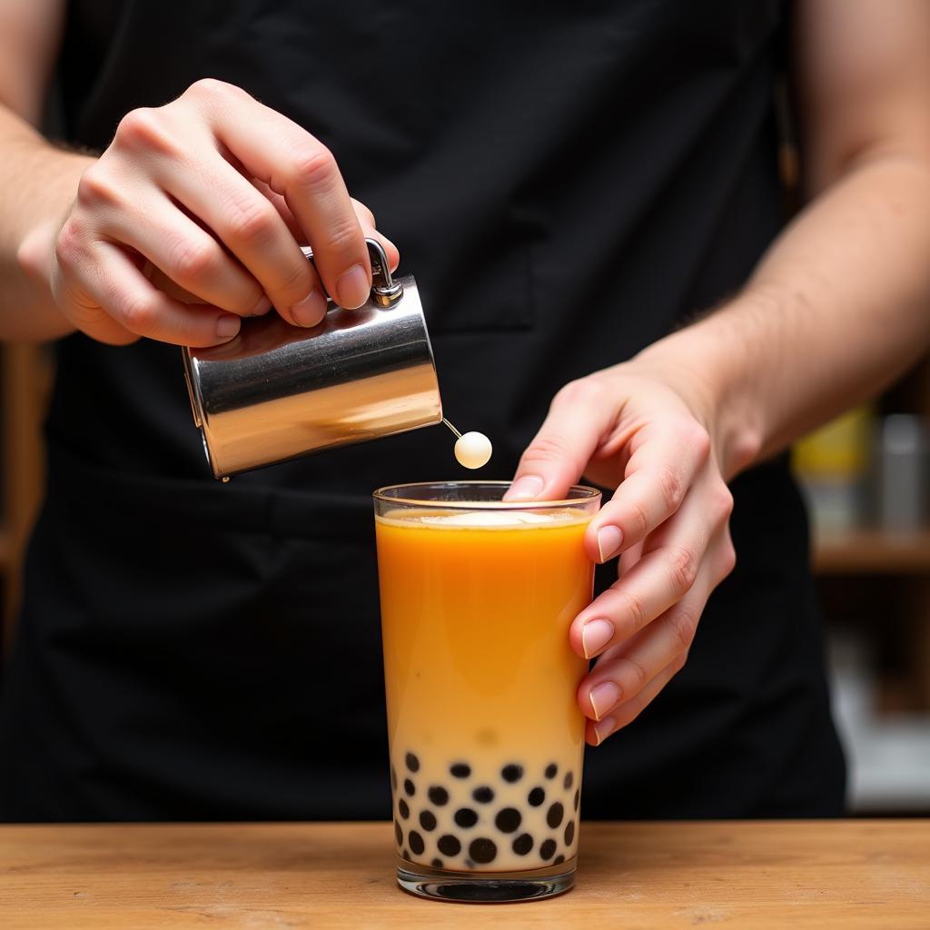 Barista crafting the perfect "bub 2" bubble tea