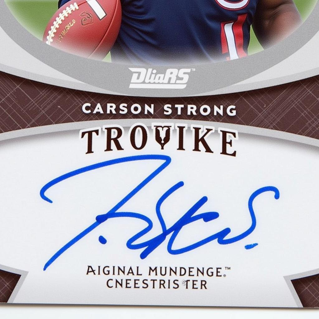 Carson Strong rookie card close-up showcasing details like team logo, card number, and player signature.