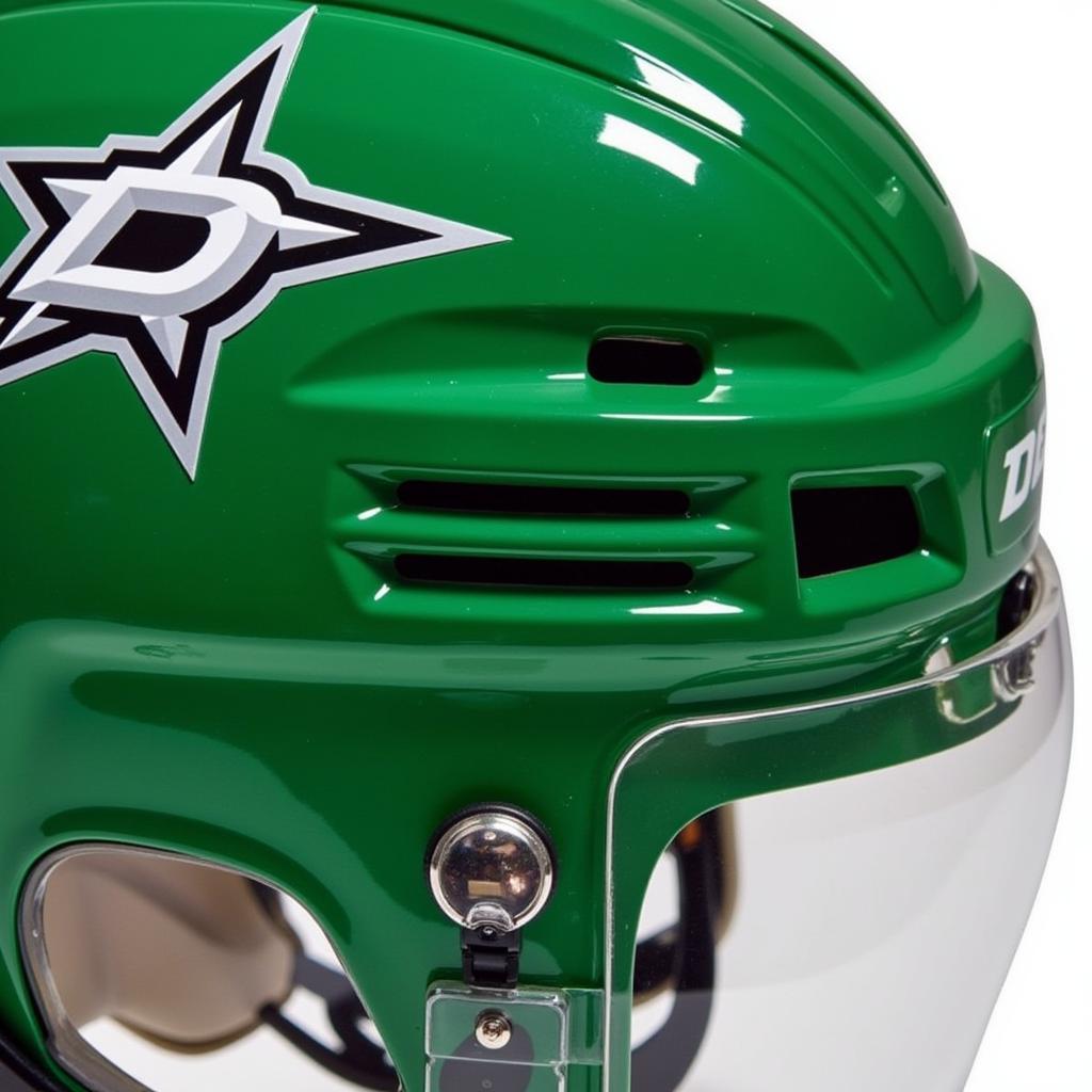 Close-up view of a Dallas Stars helmet showcasing the vibrant Victory Green, silver star, and intricate details.