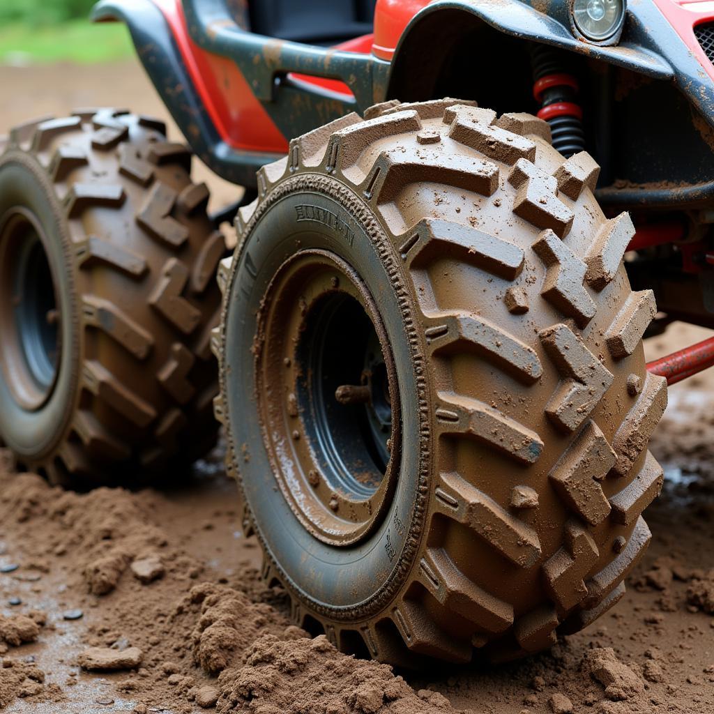 Go Kart Mud Monster Tires: Close-up view of large, knobby tires designed for optimal mud traction.