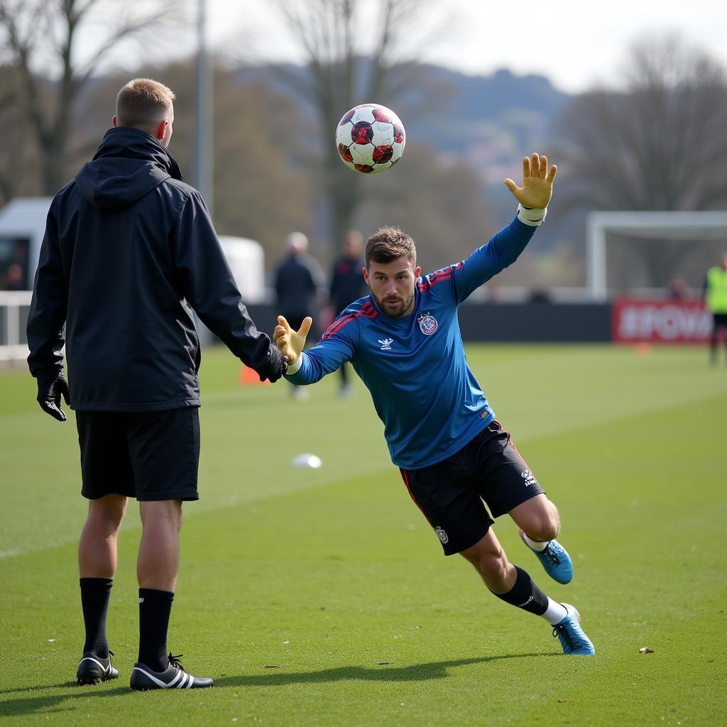 Goalkeeper performing drills with a ball deflector