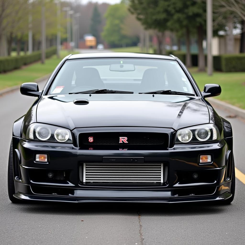 Nissan Skyline R34 widebody front view showing aggressive stance and wide fenders.