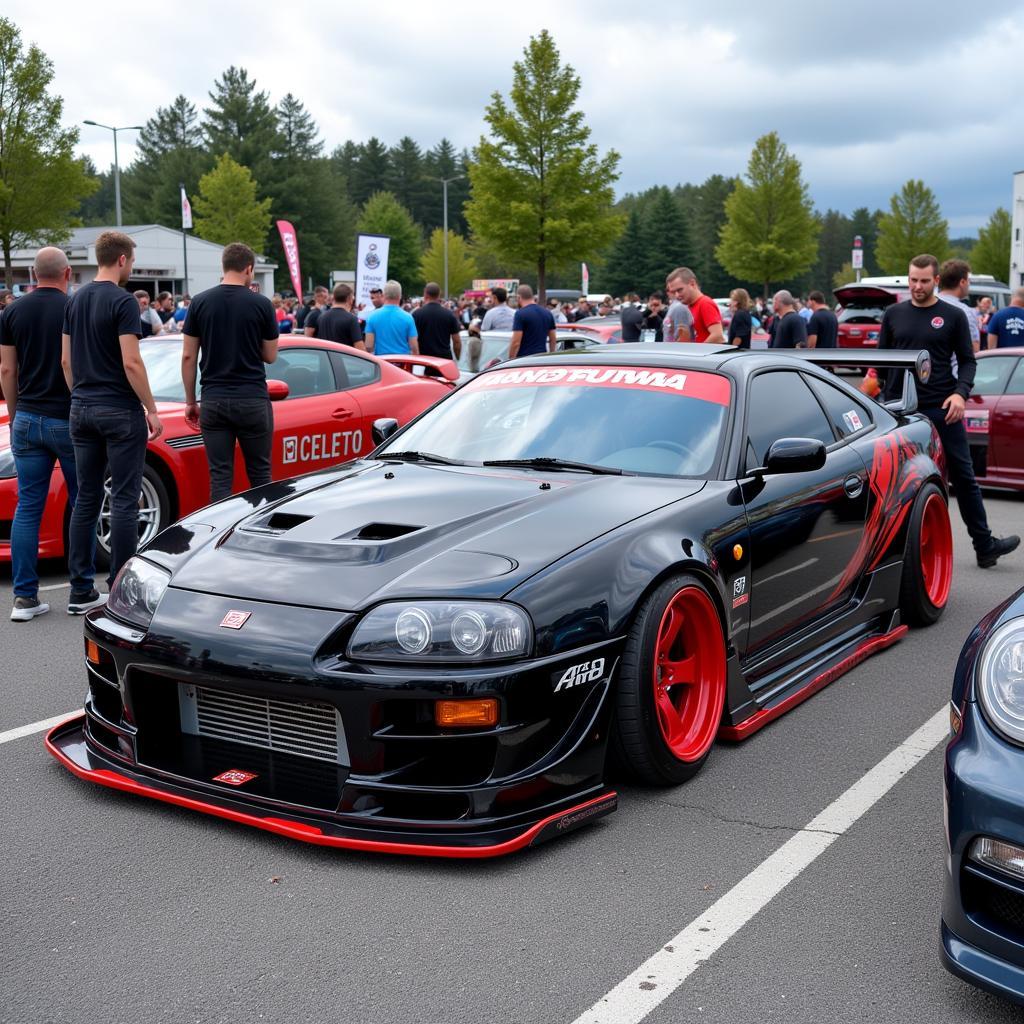 A car equipped with the V3 Rocket Bunny kit showcased at a car show, surrounded by admirers.