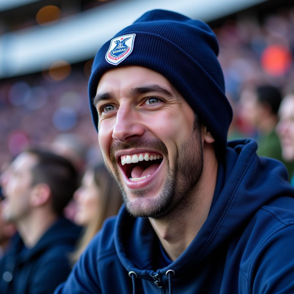 Yamal fan proudly wearing an origin beanie at the stadium, cheering for his favorite player.