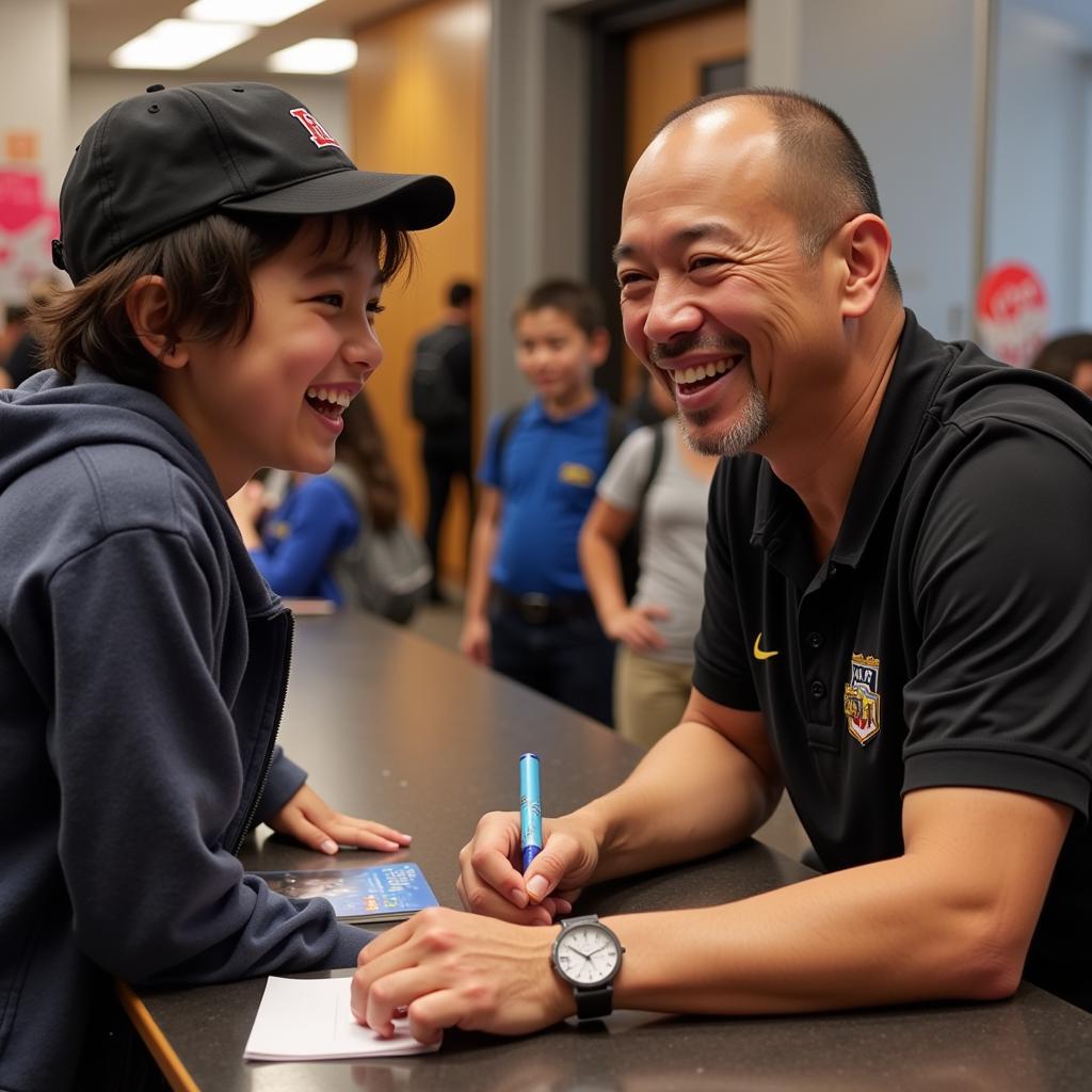 Yamal signing an autograph for a young fan