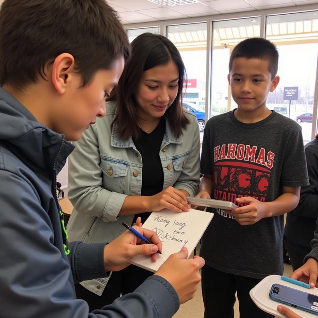 Yamal signs autographs for young fans, demonstrating his connection with his supporters.