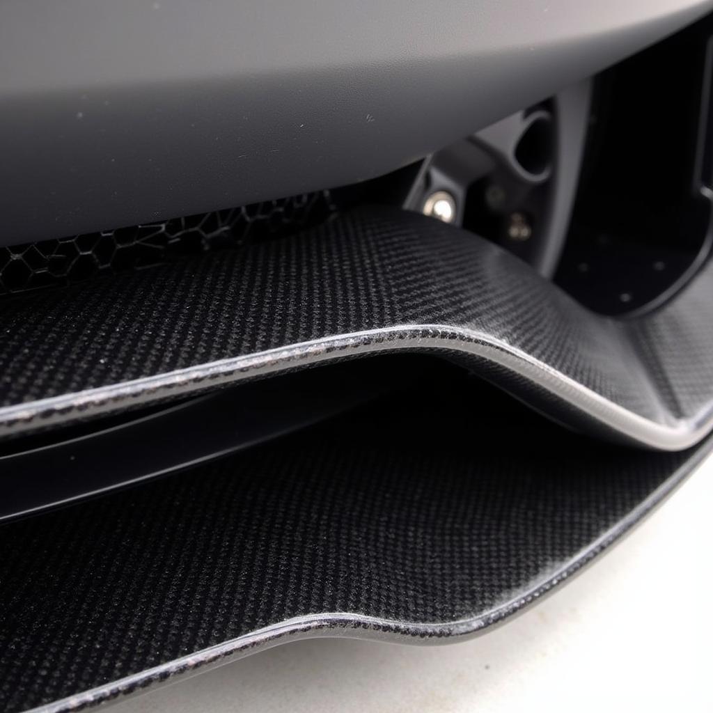 Close-up of a carbon fiber Aventador body kit, highlighting its intricate weave and lightweight construction.