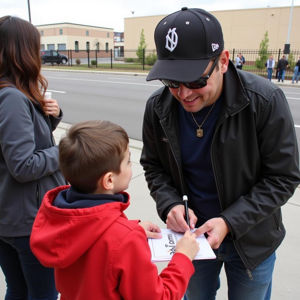 Yamal signing an autograph for a young fan, a testament to his humility and connection with his supporters.